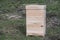 One new set of wooden beehive in the spring garden, closeup