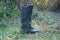 One old black dirty tarpaulin boot