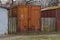 One old brown iron garage with closed gates