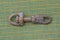 One old dirty iron brown carabiner latch in rust