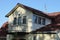 One open black iron balcony in a gray attic of a private house