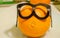 One orange with glasses, smart orange, organic food choise
