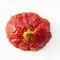 One oval ugly ripe organic strawberry with yellow tip on white background top view. Close up, Isolated, Square image