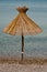 One parasol on the coast of Krk , Croatia