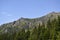 One of the peaks of the High Tatra mountains in Slovakia surrounded by forested mountains and trees