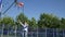 One Person Playing Basketball for Fun, a Recreational Sports Activity. Man Relaxing Playing Basketball in a Park.