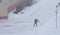 One person removes snow in a blizzard in winter, works with a shovel