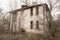 One photo of an old and terrible abandoned farmhouse, which eventually deteriorates, overgrown with old trees. Here lived an old m