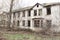 One photo of an old and terrible abandoned farmhouse, which eventually deteriorates, overgrown with old trees. Here lived an old m