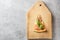 One piece of Italian pizza with tomatoes mushrooms bacon and cheese and basil leaves on wooden background cutting board