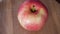One pink apple of the ligol variety, video. Fruit close-up.
