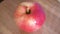 One pink apple of the ligol variety, video. Fruit close-up.