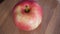 One pink apple of the ligol variety, video. Fruit close-up.