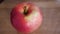 One pink apple of the ligol variety, video. Fruit close-up.