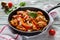 One-pot chicken fillet and orzo pasta with red bell peppers and feta cheese, cooked with garlic, paprika and olive oil.