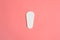 one pure empty women`s disposable daily menstrual sanitary pad or napkin on pink background.