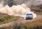 One Rally Car and a lot of Dust on a Sharp Turn