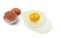 One raw chicken egg with yellow yolk and clear white egg in three layers and broken eggshell isolated on white background with