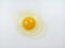 One raw chicken egg with yellow yolk and clear white egg in three layers on white background. The largest cell in the world