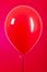 One red ball isolated on a red background, birthday decoration, valentines day, decor, red ball with shiny reflections