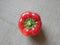 One red color raw whole Bell pepper