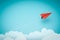 One red paper plane pointing in different way on blue background. Business for new ideas creativity and innovative solution