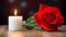 one red rose, lighting candle on the wooden table, dark blur background