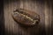 One roasted cofee bean on wooden background