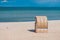 One roofed chair on empty sandy beach in Travemunde. One lonely seagull beside. Germany