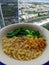 one serving of vegetable instant noodles that just cooked, friends relax in the afternoon