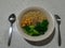 one serving of vegetable instant noodles that just cooked, friends relax in the afternoon