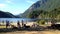 One side of people having fun on a peaceful lake shore