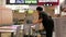 One side of worker cleaning table at food court area