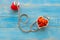 One single alone red heart love shape hand exercise ball with bandage MD medical doctor physician`s stethoscope