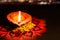 One single earthen lamp used in Luxmi poojan in Diwali with copy space