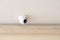 One single round security camera on a ceiling in a bright room, CCTV cam object detail, closeup, nobody. Safety, modern