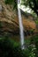 One of the Sipi Falls at Mount Elgon National Park in between lush vegetation