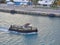 One of the small Line handling Boats coming to a Vessel to help tie the Vessel alongside the Quay at Freeport in the Caribbean.