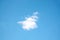 One small white cloud on light blue sky