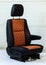 One sport seat of van with armrest with black and brown leather trim, located in the workshop for repair and tuning of cars and