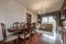 One-story living room with wooden furniture, a wooden table with matching chairs