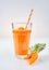 One tall glass of orange root vegetable drink