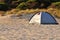 One tent on a sandy beach