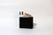 One thousand Lire of Italy banknote and mini Italia nation flag stick on the black wallet with white background