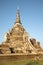 One of the three ancient stupas of the Buddhist temple Wat Phra Si Sanphet in the rays of the setting sun. Ayutthaya, Thailand