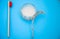 One toothbrushes, tooth powder on a blue wooden background. Minimalism, hygiene of the mouth cavity. View from above