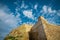 One of the towers rising from the wall of Citadel in Victoria city on the island of Gozo, Malta on a sunny day with blue skies