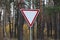 One triangular road sign give way