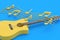 One vintage guitar and different notes on blue background