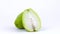 One whole and one half of chayote fruit with water drops. Rotating on the turntable. Isolated on the white background